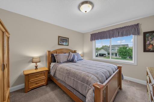 Thoughtfully designed with generous proportions and neighborhood views, this 3rd bedroom on the upper level offers plenty of space for your favorite furnishings and decor.