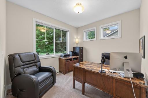 Conveniently situated near the foyer, this versatile room is ideal as a home office, study, library, or creative space to fit your lifestyle.