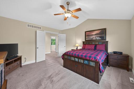 Your private retreat awaits in this expansive primary suite, where vaulted ceilings, abundant space, and a tranquil setting create the perfect place to begin and end each day.