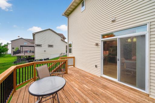 Whether you're sipping coffee at sunrise or gathering with friends and family for a summer barbeque, this expansive deck creates the perfect backdrop for outdoor enjoyment.