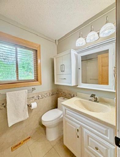There is a full bath in the hallway at the upper level that serves the bedrooms.