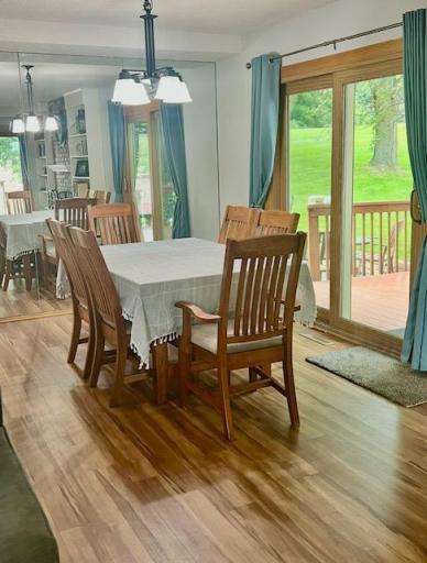 Dining area is bright and adjoins the deck.