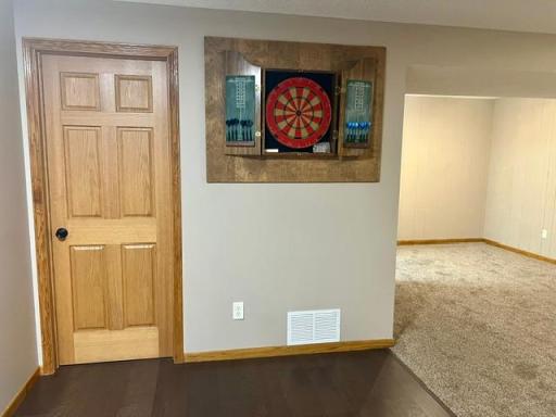 The family room includes a fun dart game set.