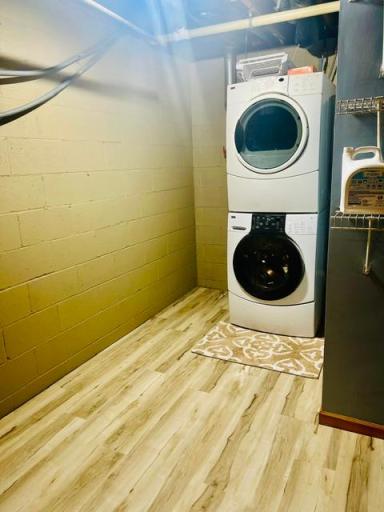 The lower level laundry room includes a washer and dryer for the new homeowner.