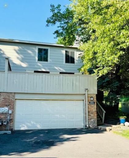 Nice brick accents frame the 2 car garage.