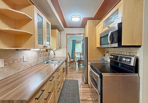 This kitchen includes stainless steel appliances.