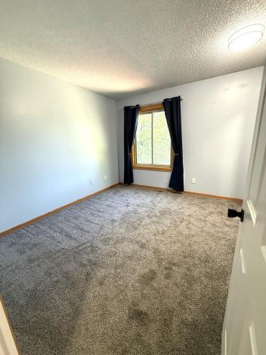 New carpet and sun-blocking drapery are included.