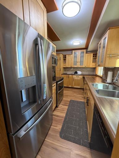 A brand new, armoire style refrigerator awaits the new homeowners use.