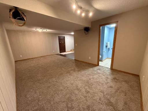 The family room at the lower level offers generous space.