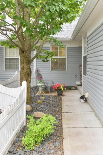 Front entry and courtyard offer a charming and inviting welcome home.