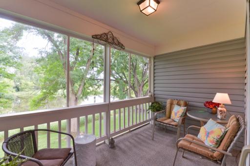 Relax and enjoy peaceful pond views from the private screened porch surrounded by mature trees.
