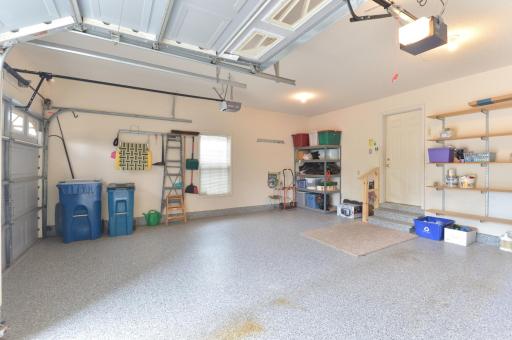 Finished two-car garage offers plenty of room for vehicles, storage, and more.