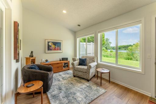 Sunroom is light filled but feels private with views of Markgrafs Lake.