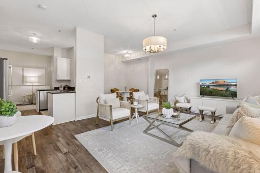The beautiful chandelier is front and center and you can easily see the openness of this condo.