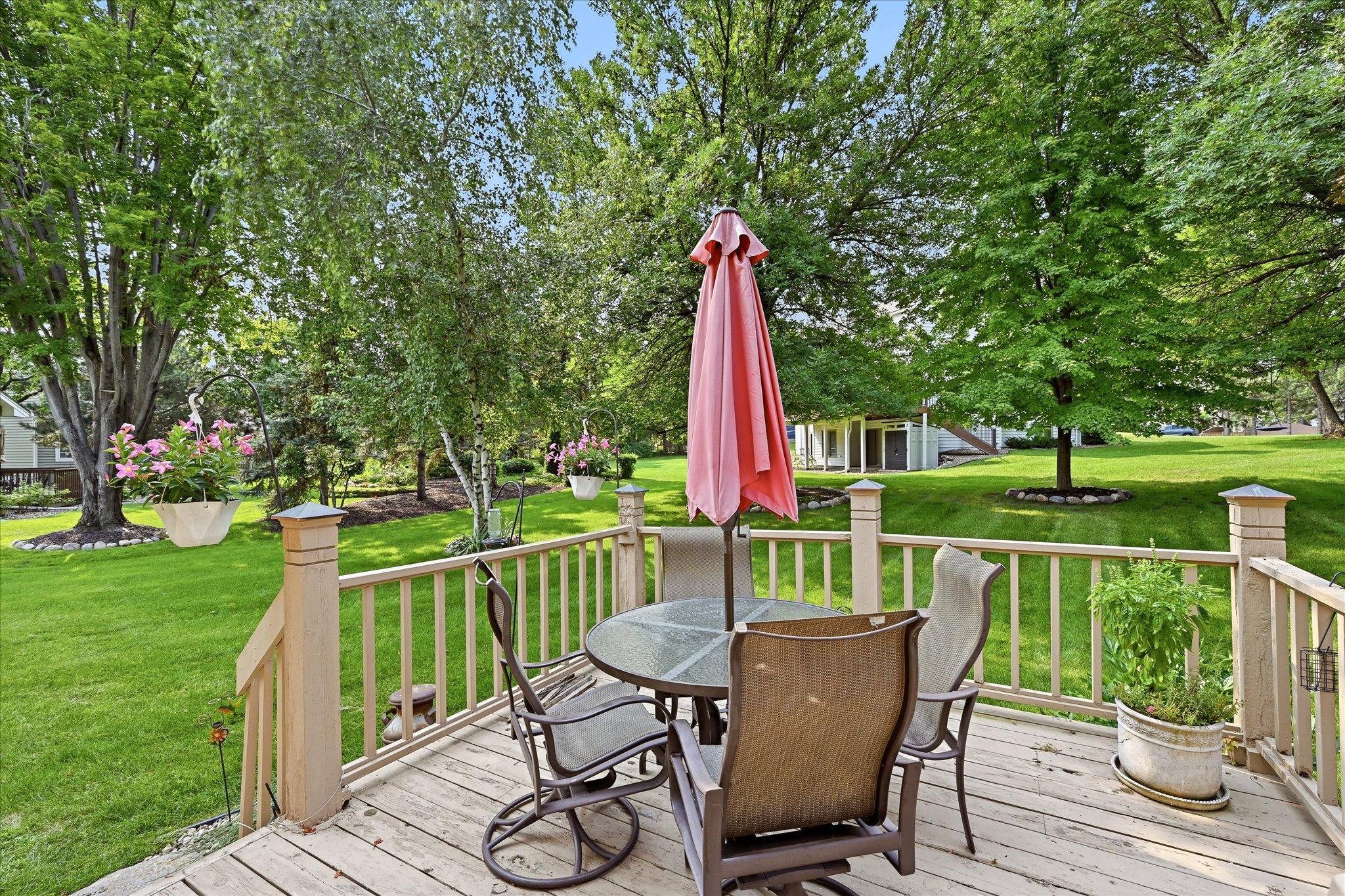 Step directly from the kitchen dining area onto the deck for easy access to the backyard and outdoor living space.
