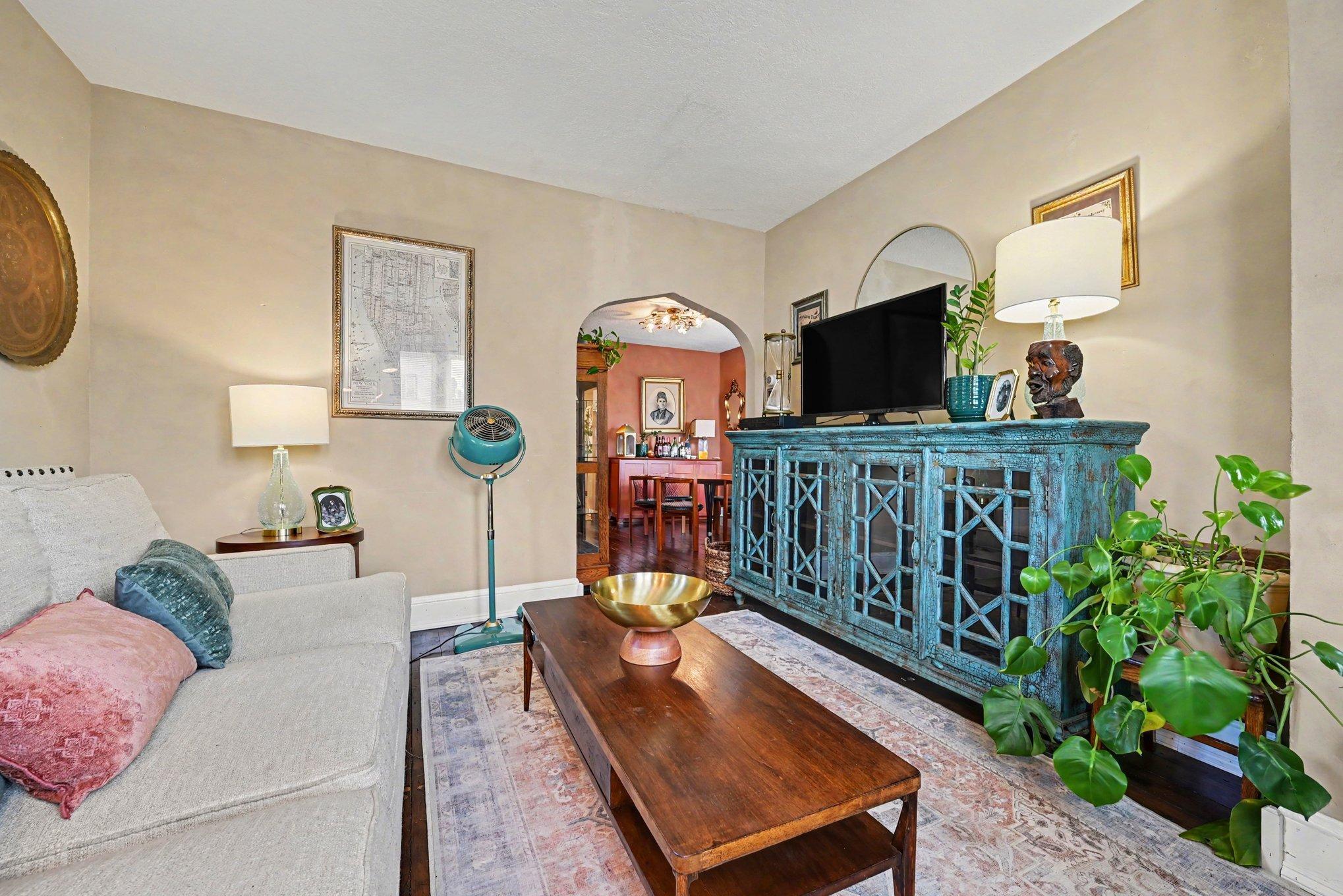 Hardwood floors continue into the living room from the dining room. Plenty of space for a media center!