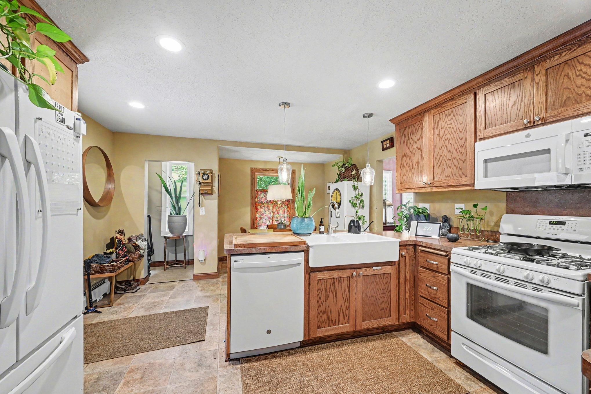 The main floor laundry is conveniently located in the kitchen, and features a mudroom by the back door.