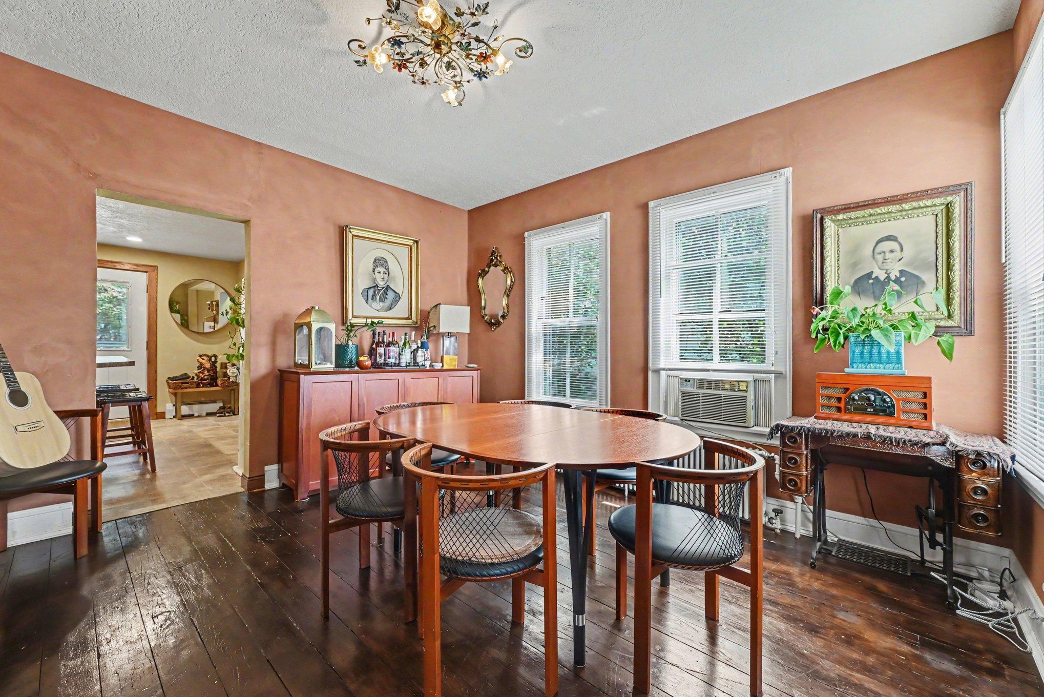 Kitchen is just through the arch and an office or small guest room behind the French doors.