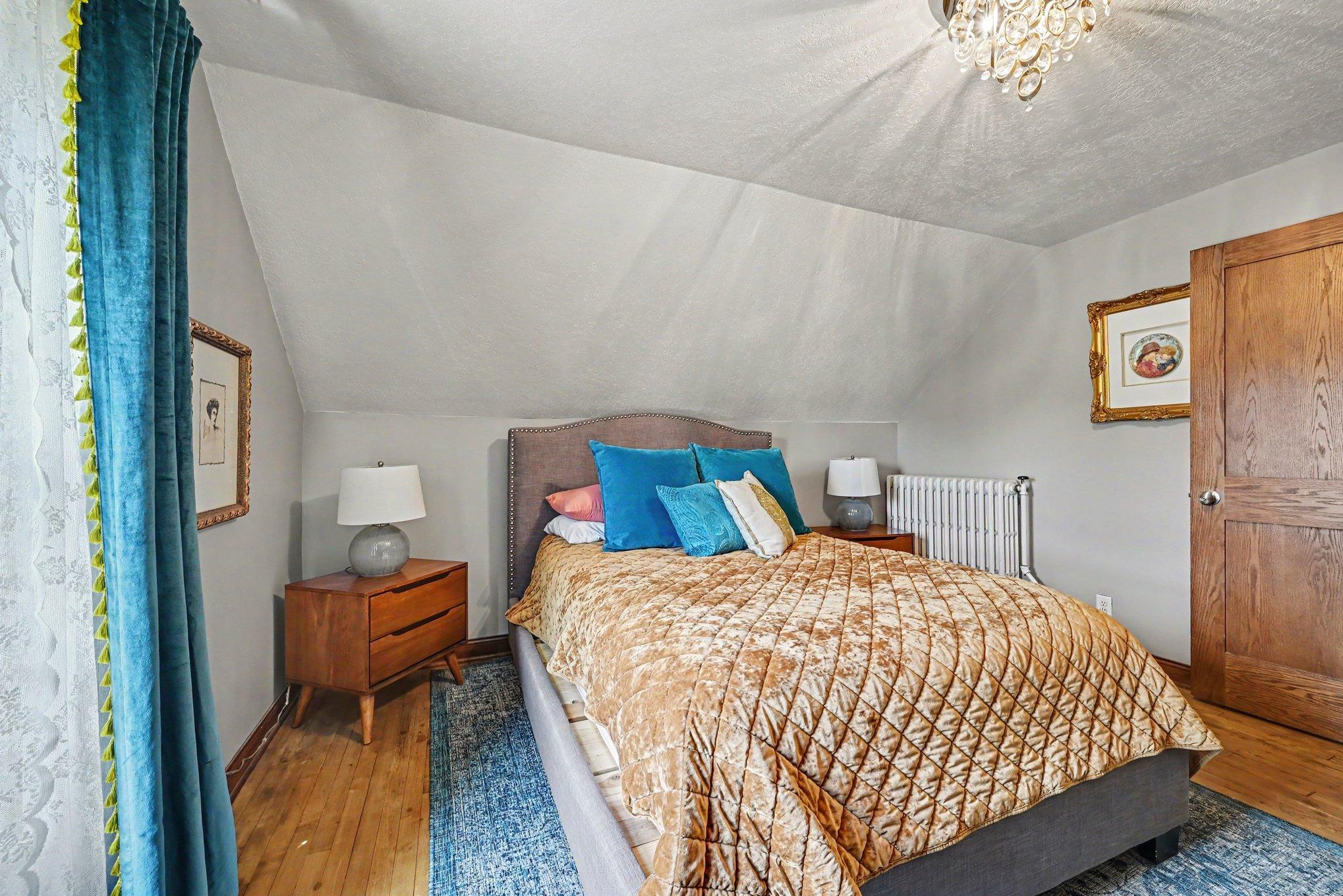You'll find two large bedrooms upstairs, both feature beautiful hardwood floors, an oak paneled door and beautfiul woodwork.