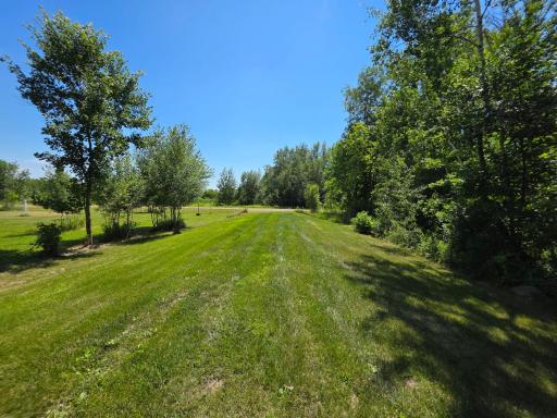 The land has been thoughtfully cleared and meticulously maintained while still preserving the natural beauty of the woods and area around it.
