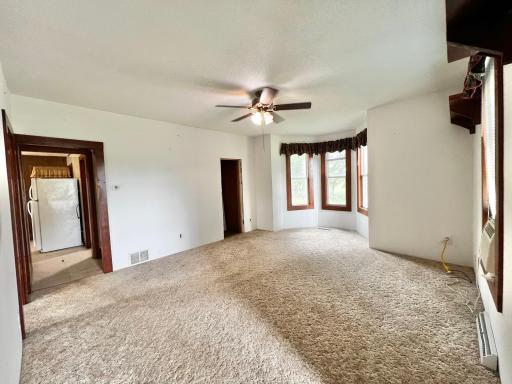 Living Room with View of Kitchen and doorway to Stairway