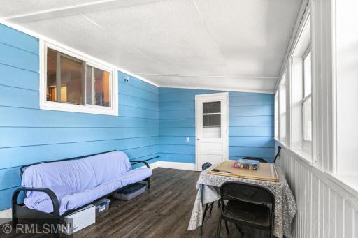 Enclosed back porch. Seller has used this space as a 4 season with addition of a portable space heater.
