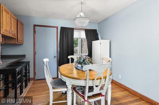 Informal dining room with door to enclosed back porch.