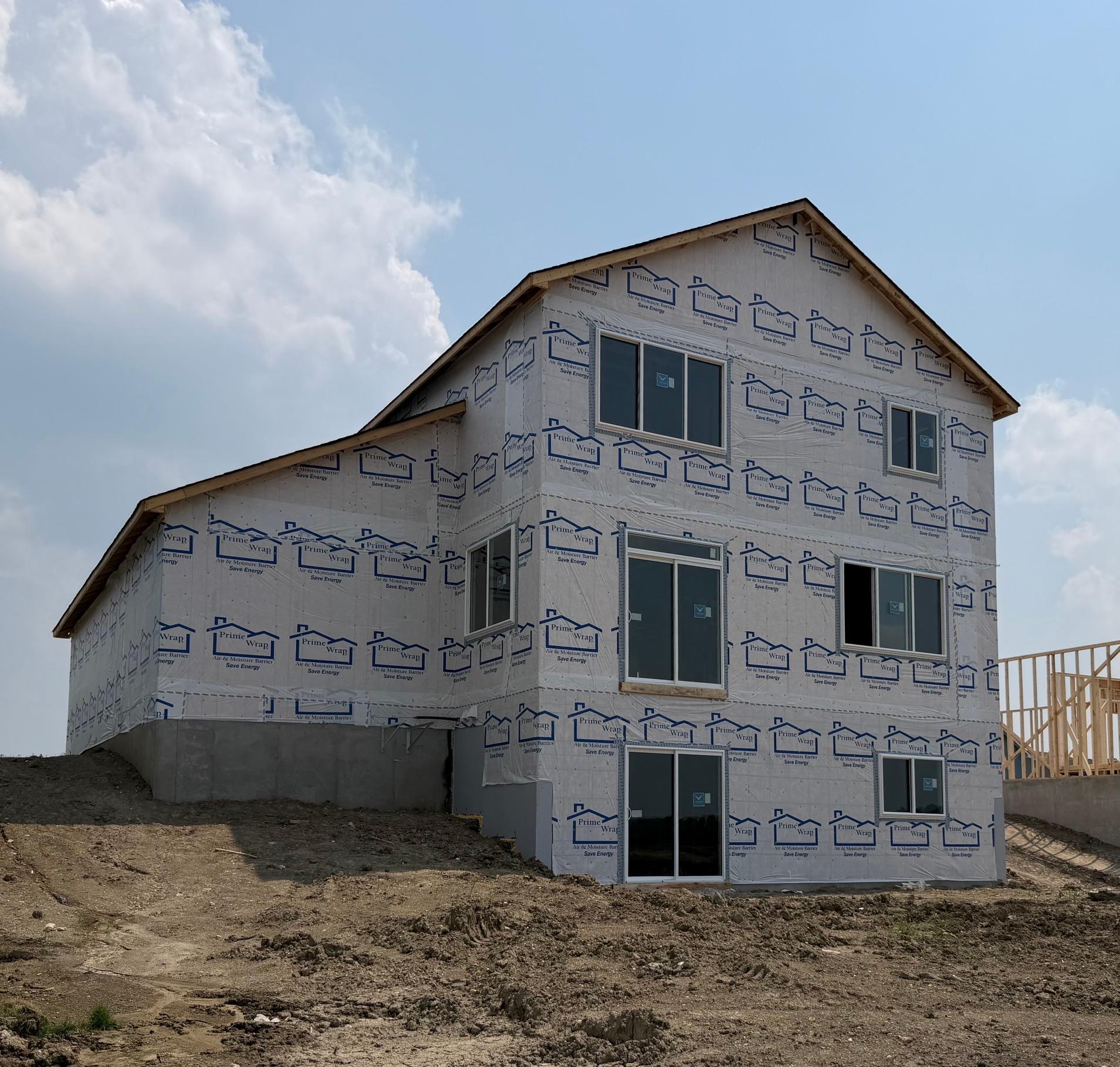 3135 Jandura Ave NE- Home features a walkout lower level to spacious backyard.