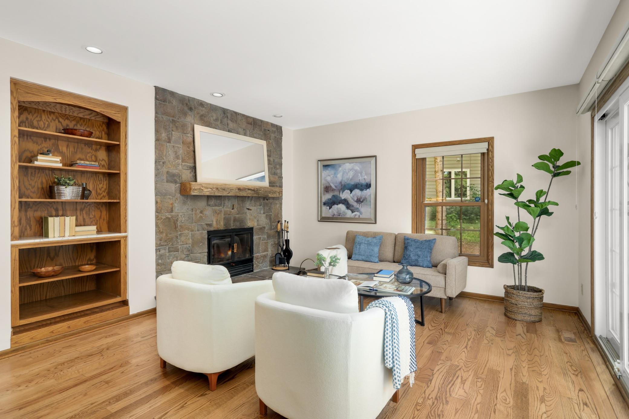 Stunning stone faced 2-sided wood burning fireplace