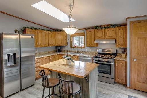 Pretty kitchen with stainless appliance and new sink has just been installed.