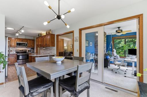Dining area with an open connection to the kitchen, living room, and sunroom.