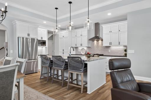 Classic tile backsplash and cabinetry paired with top of the line granite for timeless elegance.