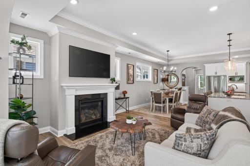 Cozy gas fireplace is a focal point of the living room.