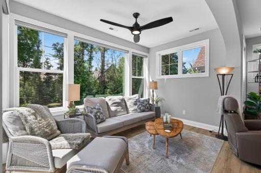 Large windows boast views of the beautiful woods behind the home and let in tons of light.