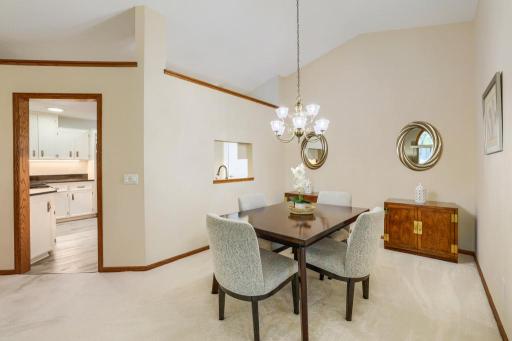 Dining room leads into kitchen - high ceilings give this a very open feel.