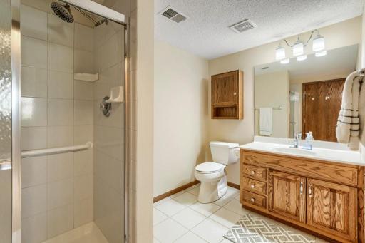 Lower level bath with shower and tile flooring