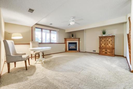 Huge lower level family room with gas fireplace. A great spot for entertaining, relaxing or crafting.
