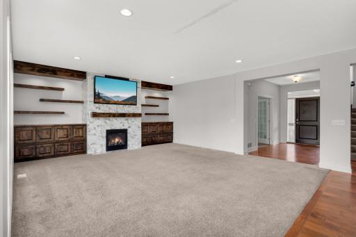 Spacious living room is perfect for entertaining or relaxing by the fire.