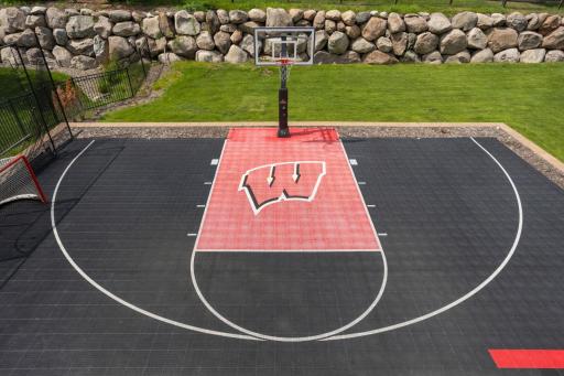 Fun outdoor sports court perfect for shooting hoops, hockey pucks or whatever you want!