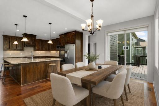 Spacious dining room that is off the kitchen and deck area (virtually staged photo)