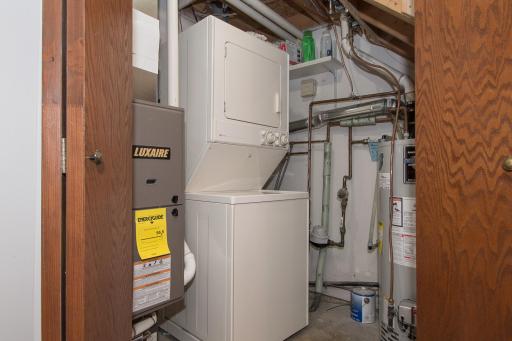 Stackable Maytag washer/dryer in mechanical room