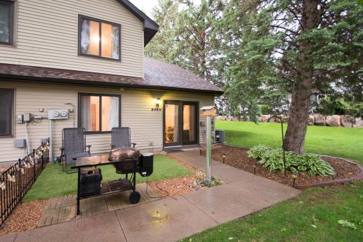Artificial turf added to front area for low-maintenance curb appeal