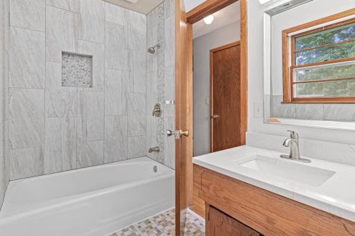 Upstairs is a newly updated full bathroom.