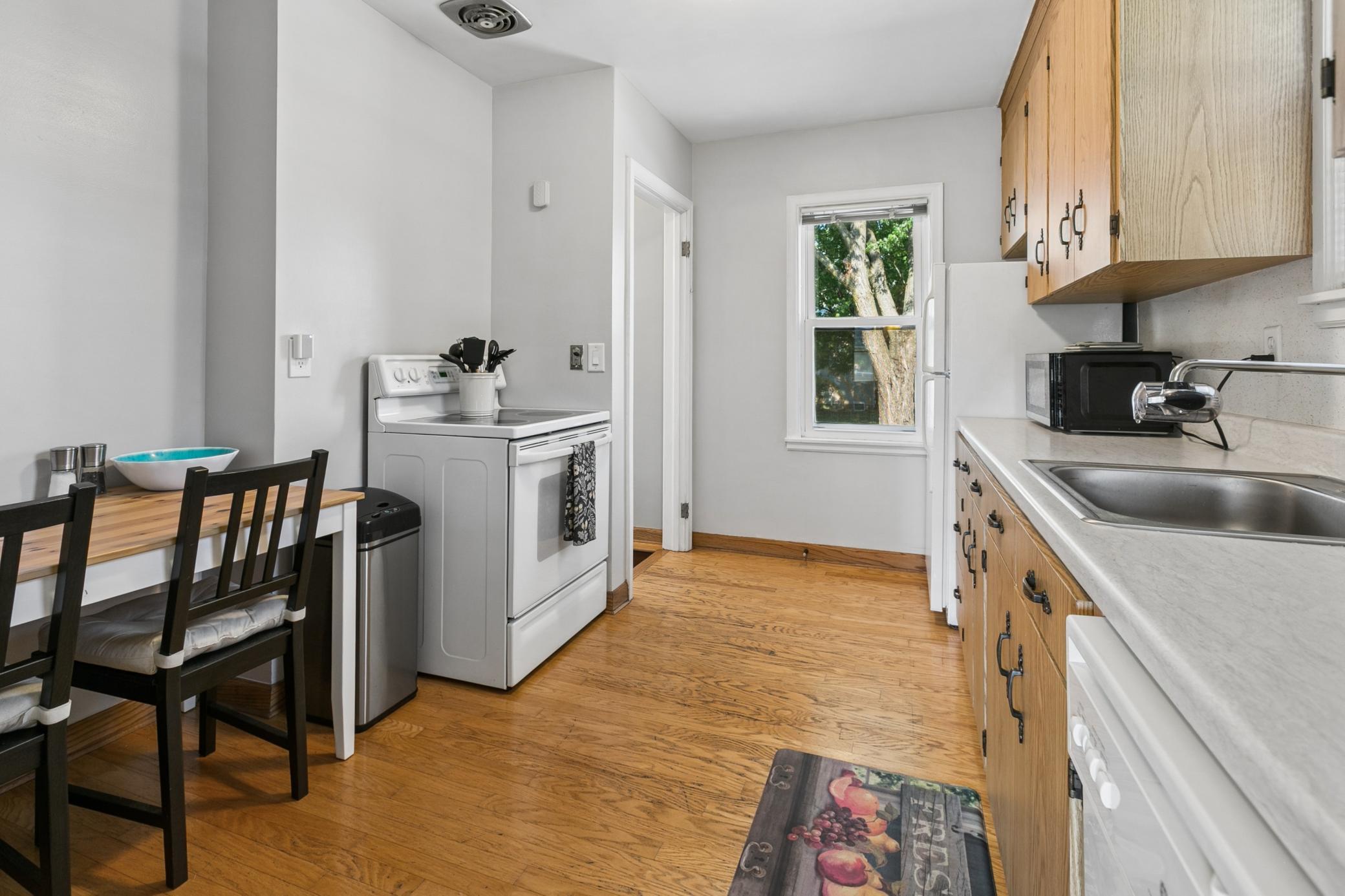 Efficient and tidy, lots of natural light with two windows, this eat-in kitchen is a great space to whip up a meal.