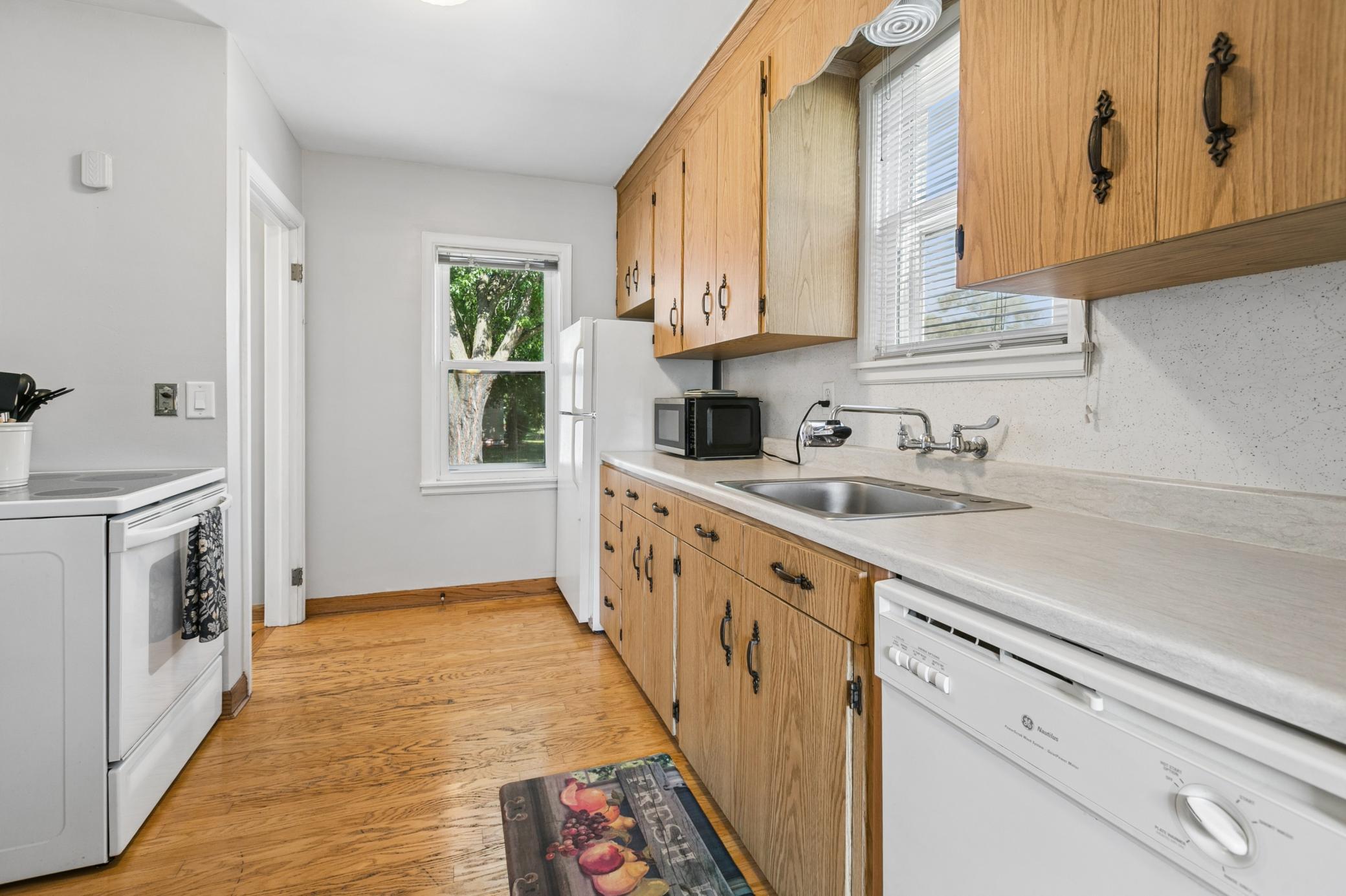 The kitchen is convenient to the side entrance, steps away from the garage and driveway and your car loaded with groceries! :)