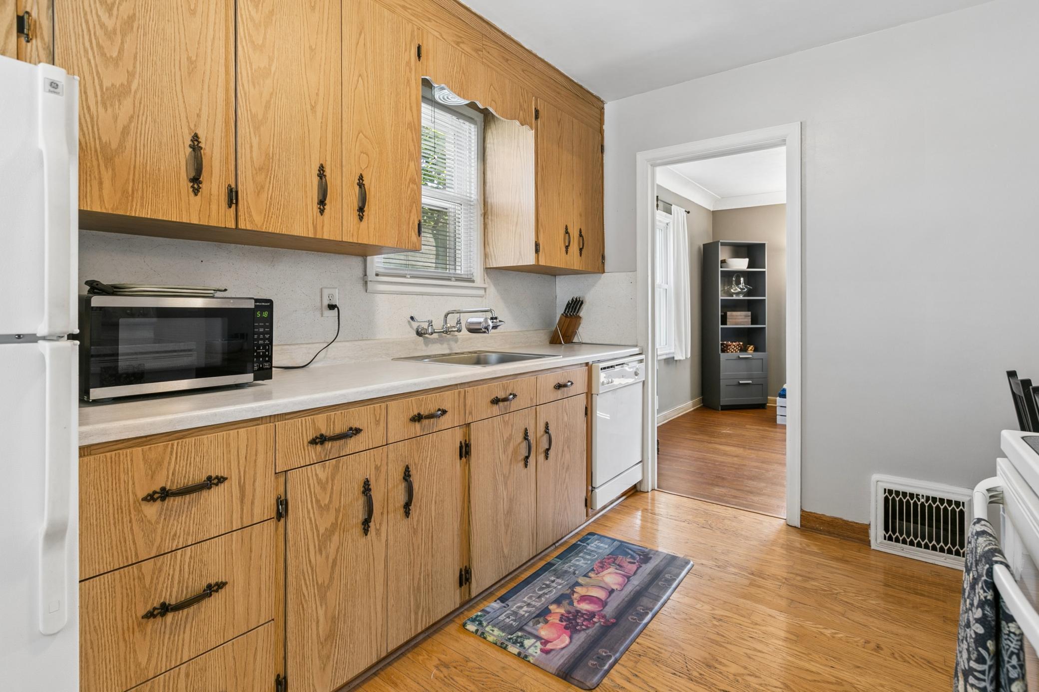 Ample storage for your kitchen gadgets. Water filtration will stay. Lots of character found throughout the home, including the original metal heat vents, hardwood floors and original paneled doors.