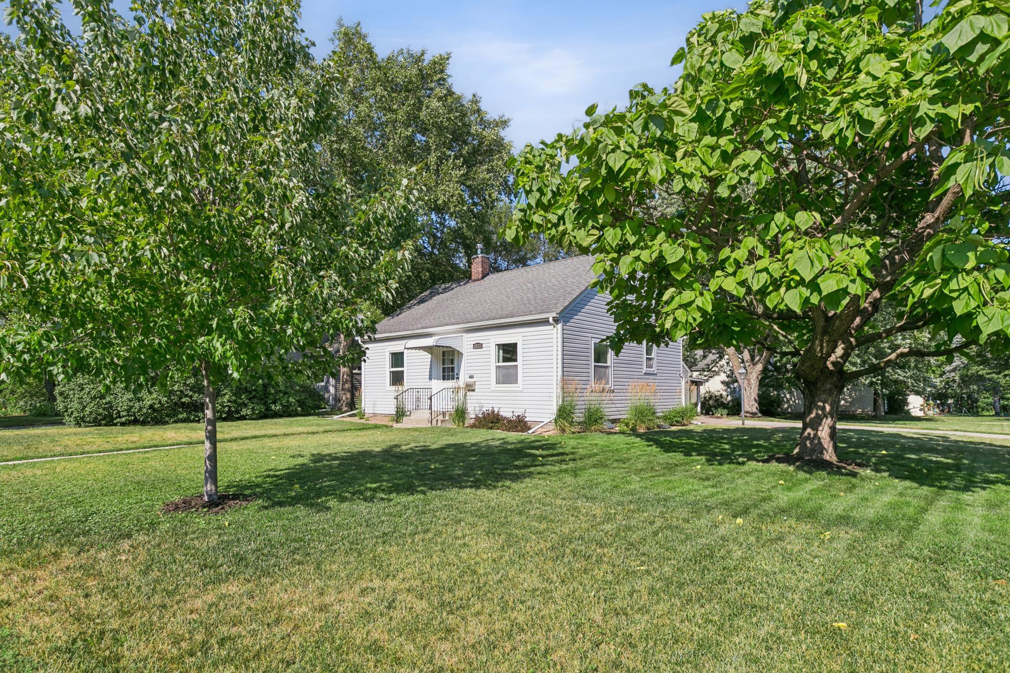 The corner lot provides amazing green space, simple, low-maintenance landscaping, sunny spots and lots of shade.