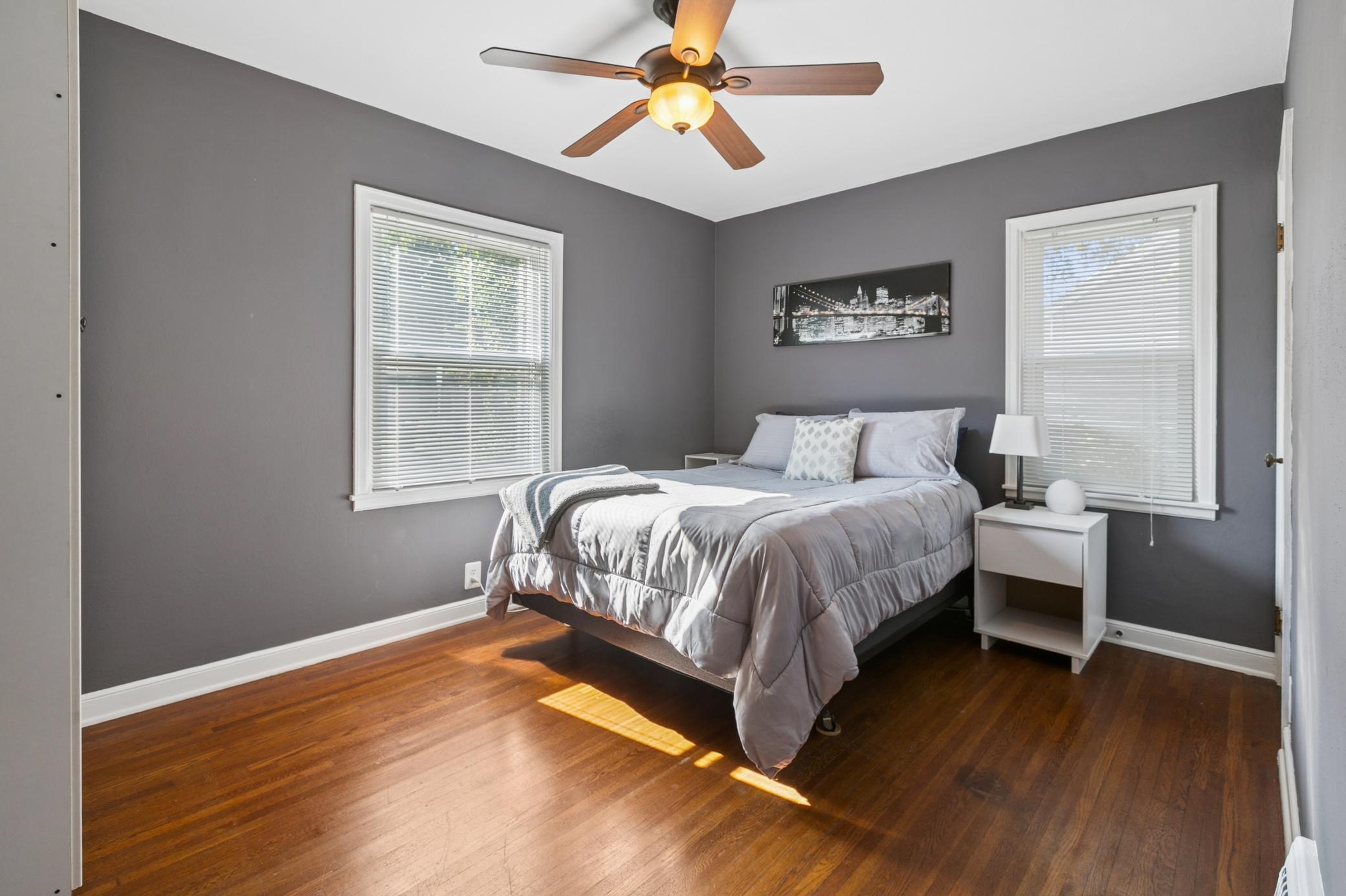 Both main floor bedrooms have polished, natural hardwood floors, corner windows- streaming natural light and a refreshing cross-breeze on cooler days. In addition to the closets, both rooms include large wardrobes for even more storage.