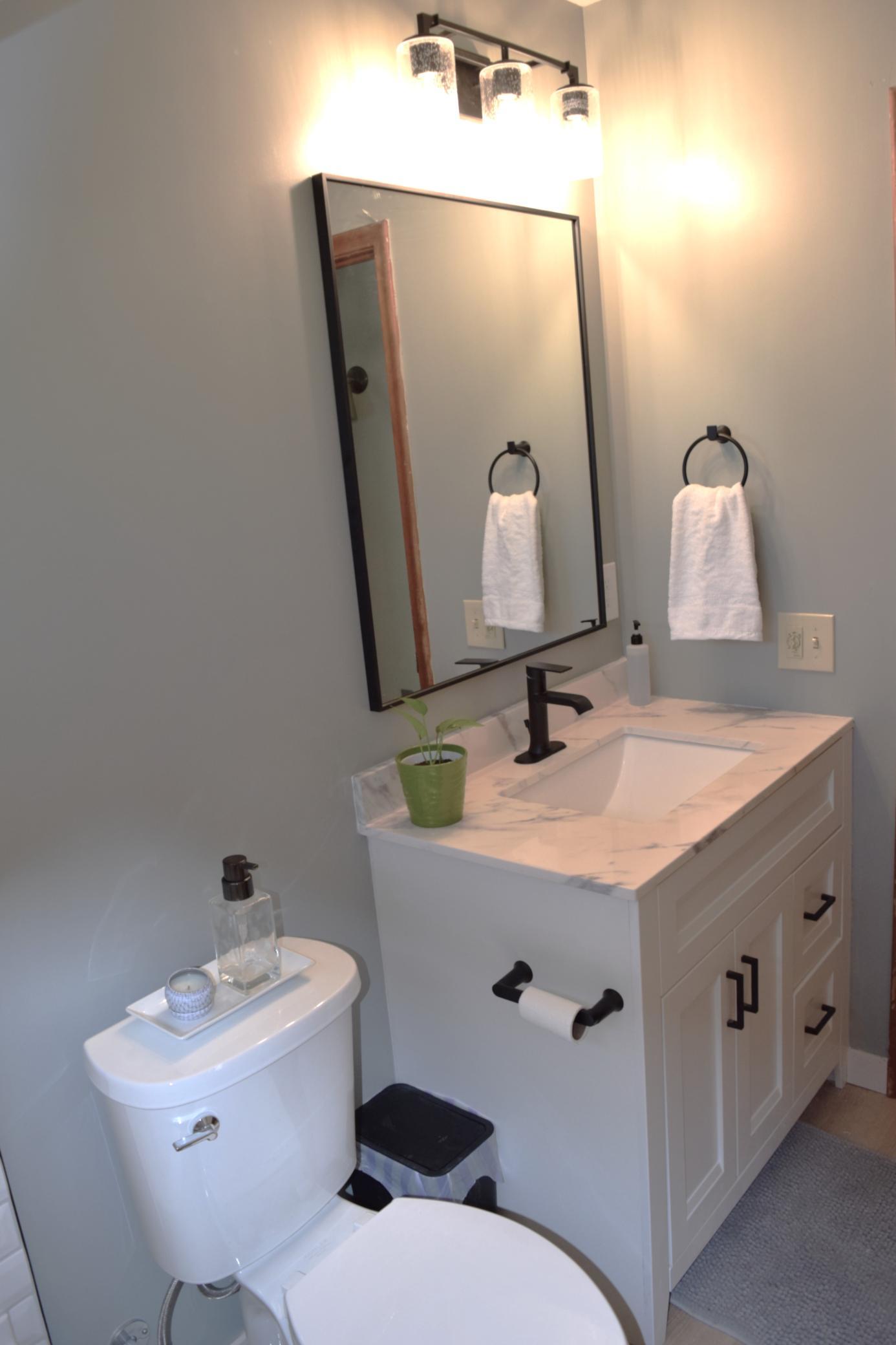 Plenty of storage in the vanity with two large drawers and a cupboard!