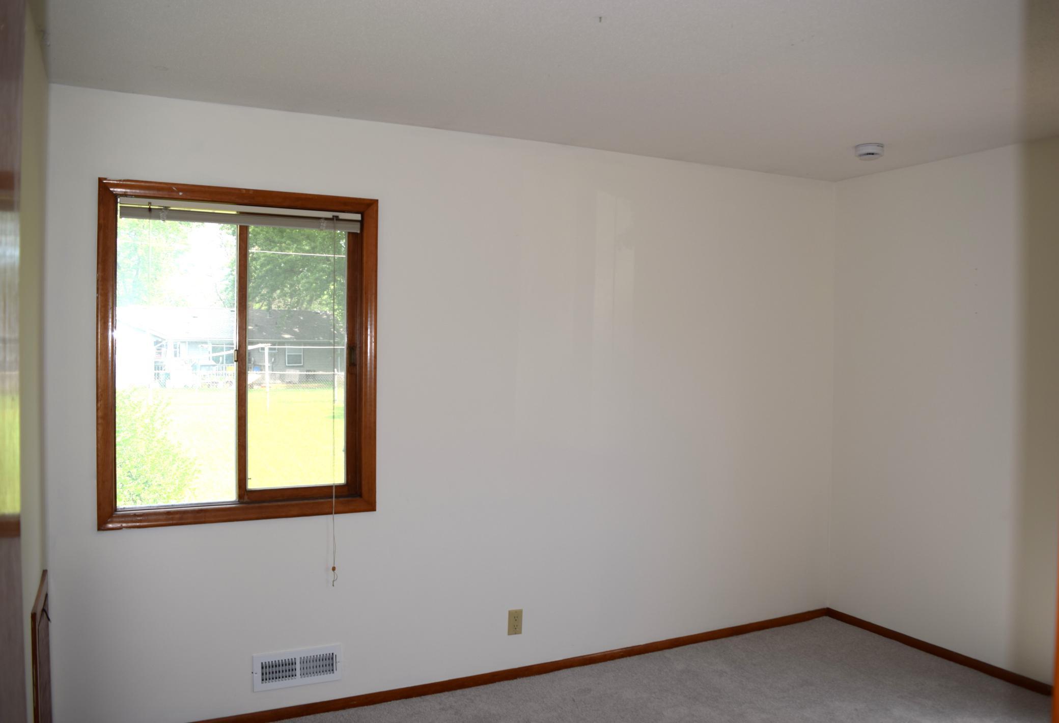 The primary bedroom has two large windows and fills with light. It also overlooks the backyard!